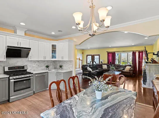 a bathroom with a sink vanity mirror and toilet