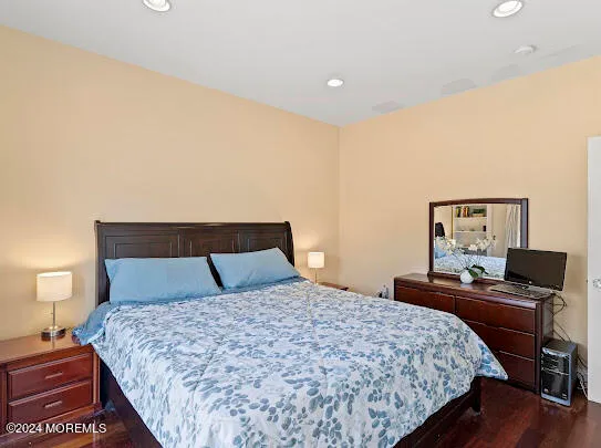 a bedroom with a large bed and a large window