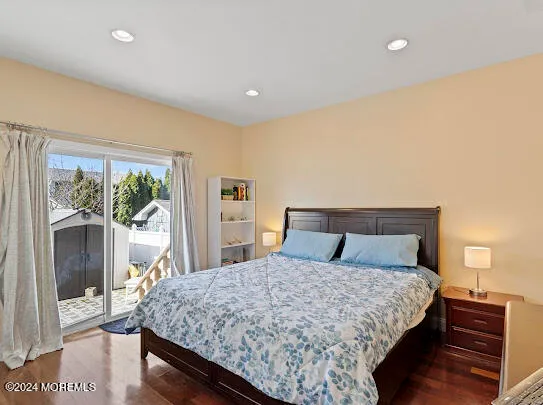 a bedroom with a bed and a night stand