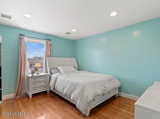 a bedroom with a large bed and a closet