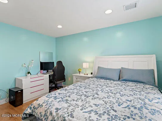 a spacious bathroom with a granite countertop bathtub sink and mirror