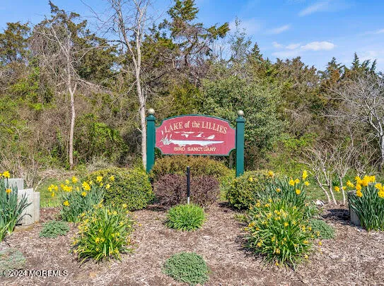 a living room with furniture a rug and a flat screen tv