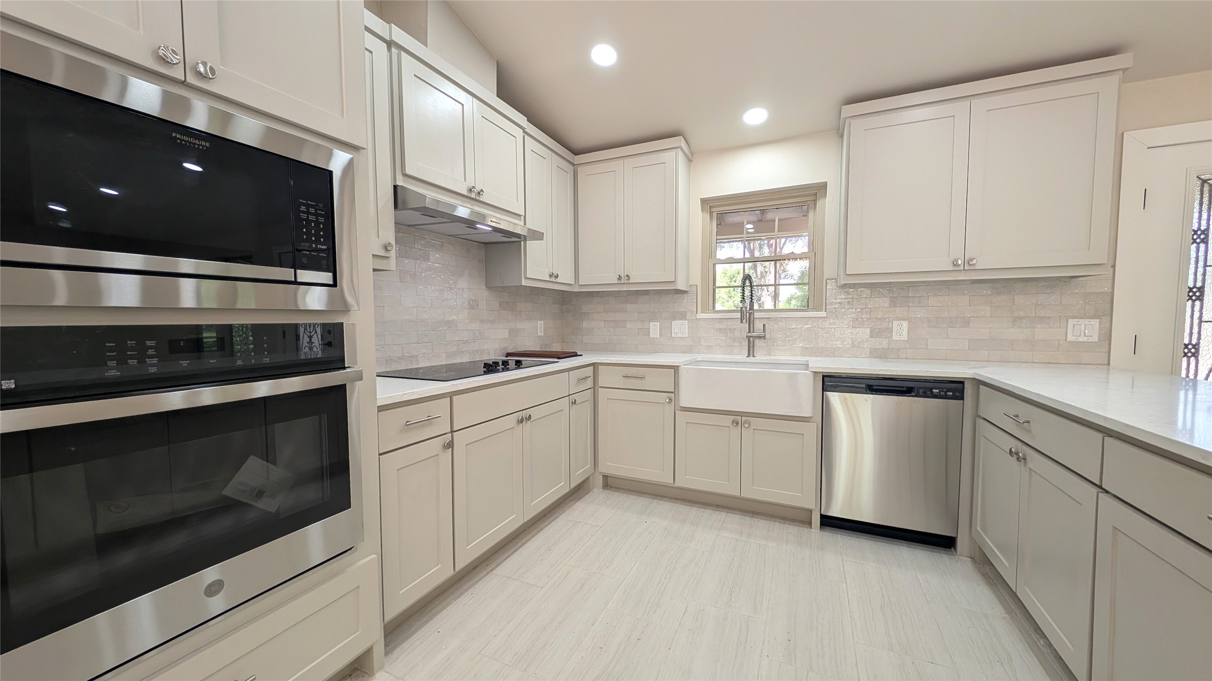 11811 Sleepy Hollow Road Manchaca, TX 78652 - Photo 10 of 31 a kitchen with white cabinets appliances and a sink