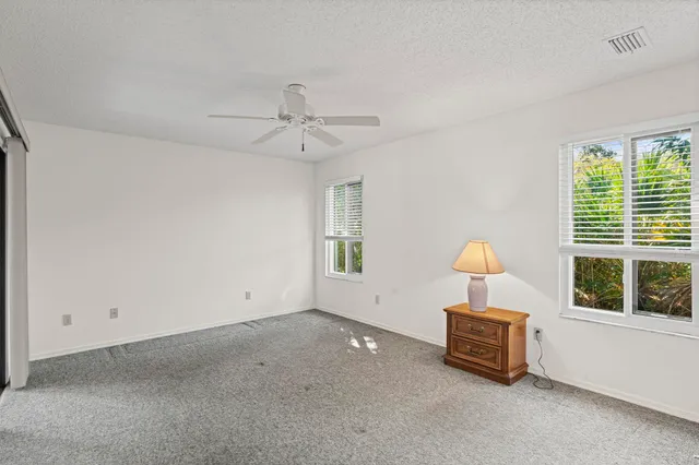 a view of room with furniture and window