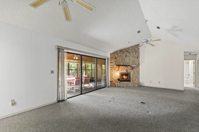 a view of empty room with fireplace
