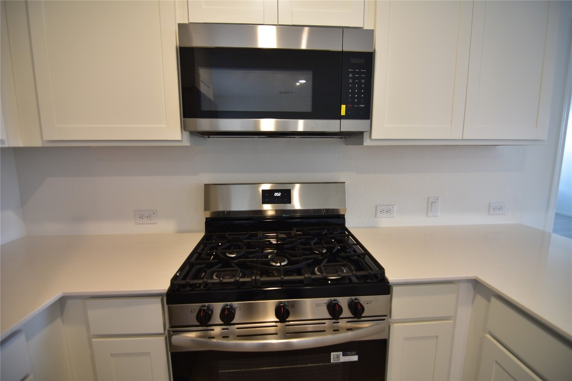 373 Keefer Kyle, TX 78640 - Photo 10 of 39 a stove top oven sitting inside of a kitchen