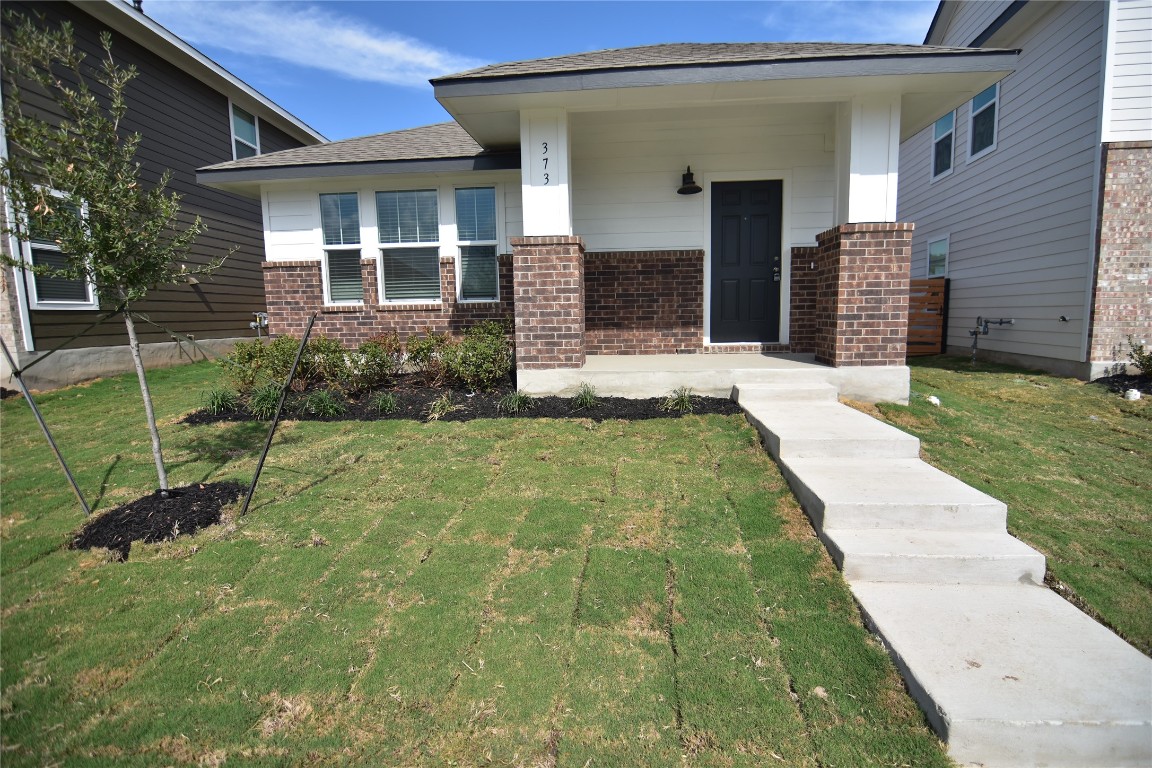 373 Keefer Kyle, TX 78640 - Photo 2 of 39 a front view of a house with a yard