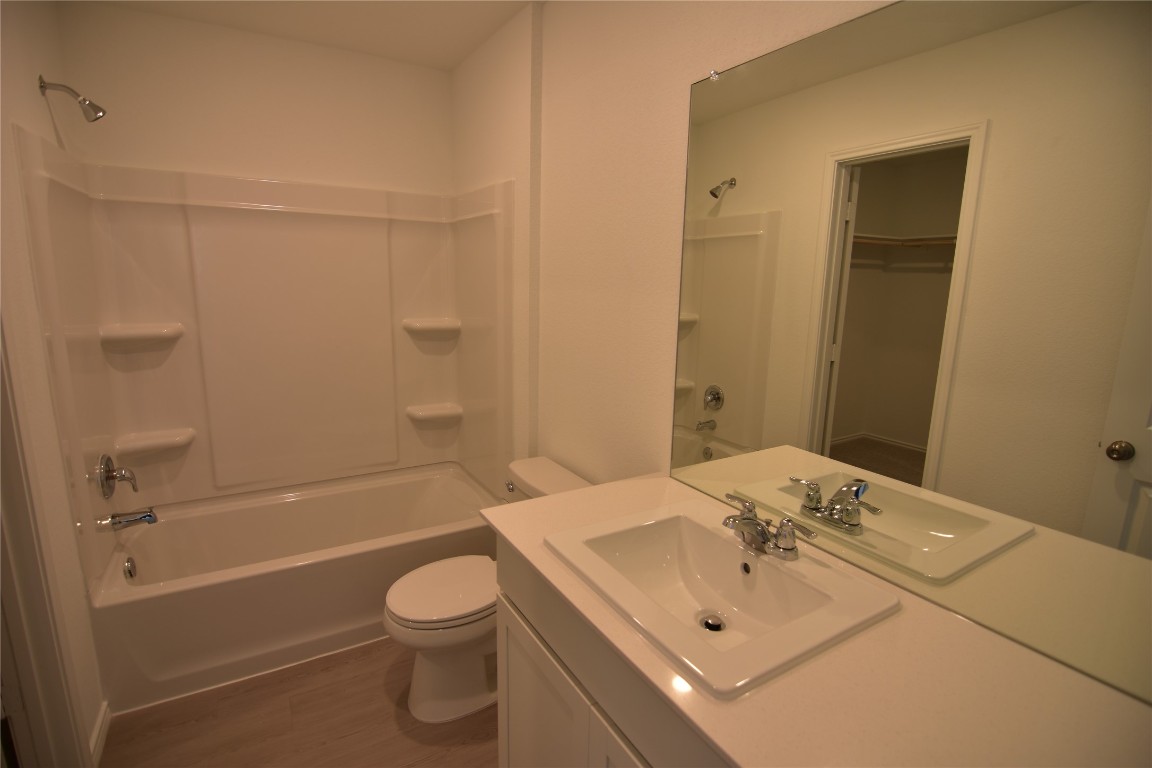 373 Keefer Kyle, TX 78640 - Photo 26 of 39 a bathroom with a sink a toilet and shower