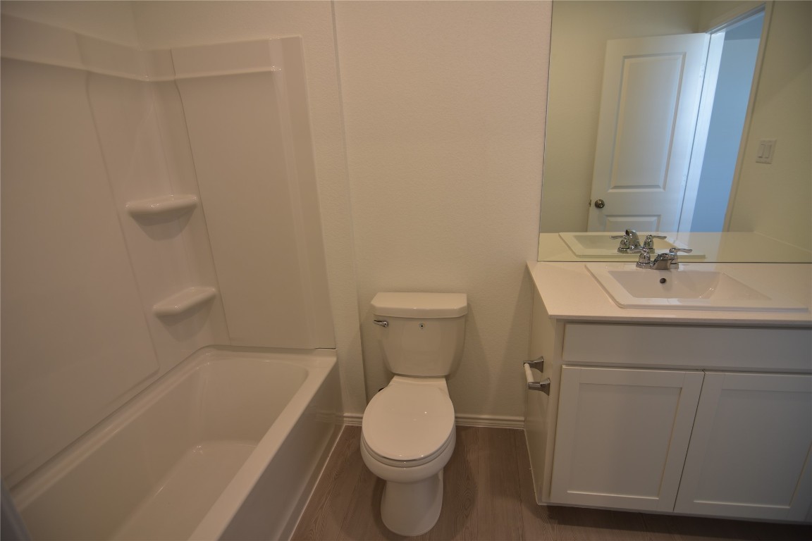 373 Keefer Kyle, TX 78640 - Photo 27 of 39 a bathroom with a sink a toilet and bathtub