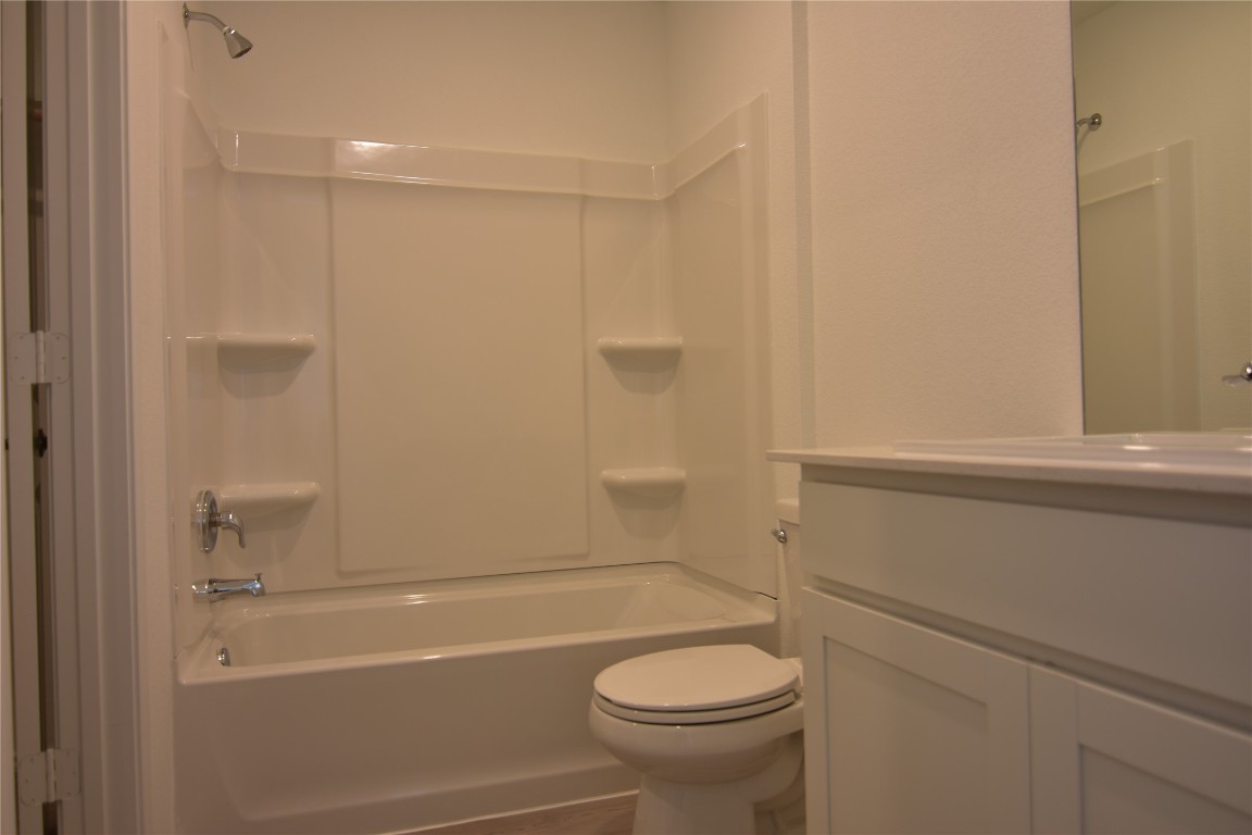 373 Keefer Kyle, TX 78640 - Photo 29 of 39 a bathroom with a sink a toilet and shower
