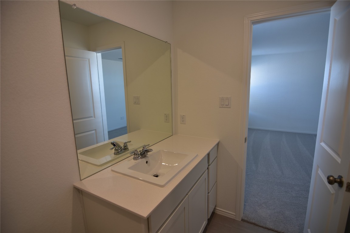 373 Keefer Kyle, TX 78640 - Photo 30 of 39 a bathroom with a sink and a mirror