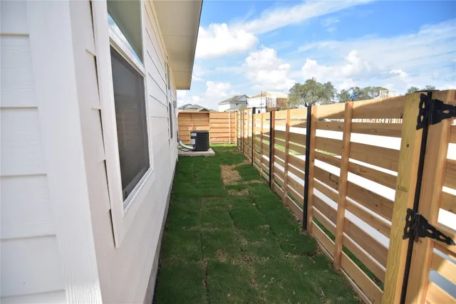 an empty room with a empty space and windows