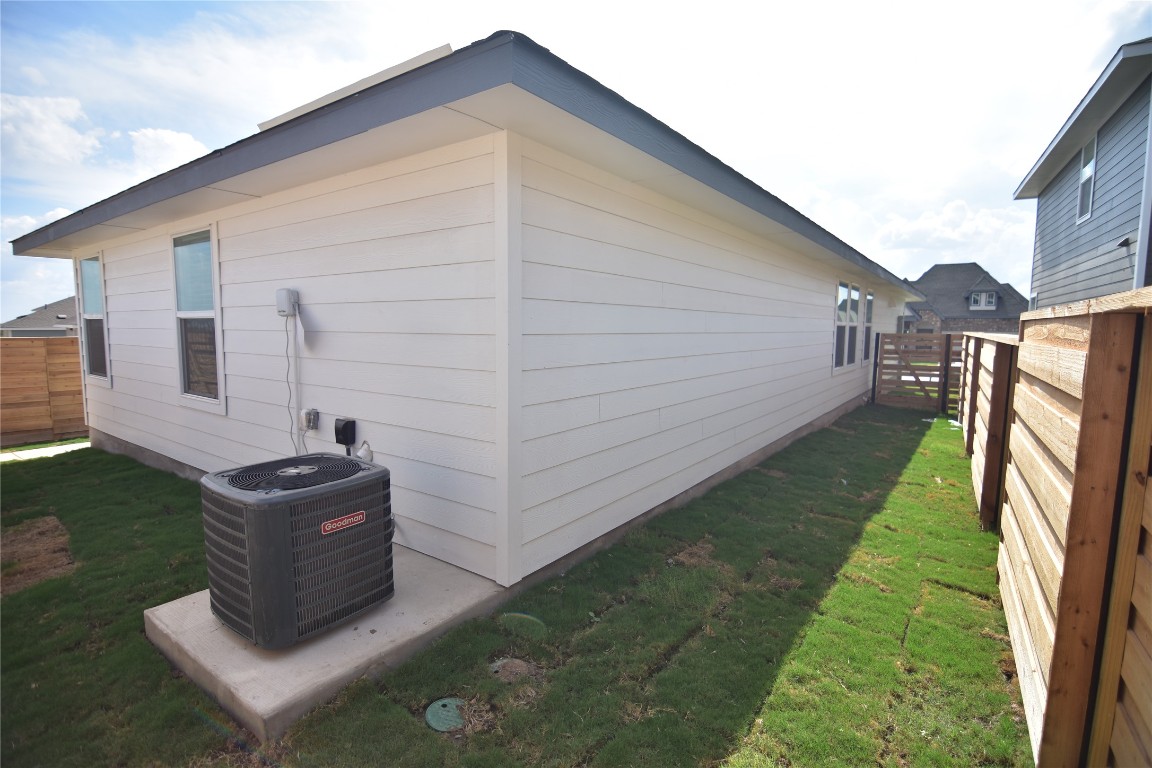 373 Keefer Kyle, TX 78640 - Photo 6 of 39 a backyard of a house with wooden fence and a yard