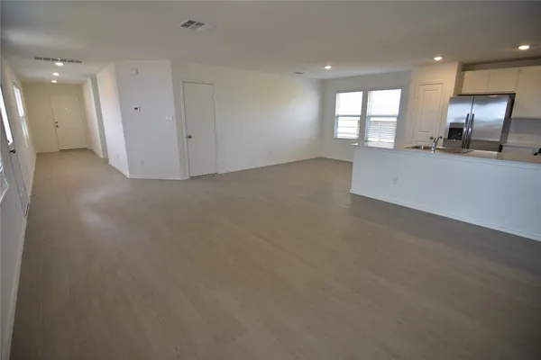 a view of an empty room and a windows