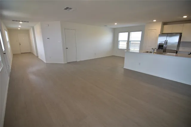 a view of an empty room and a windows