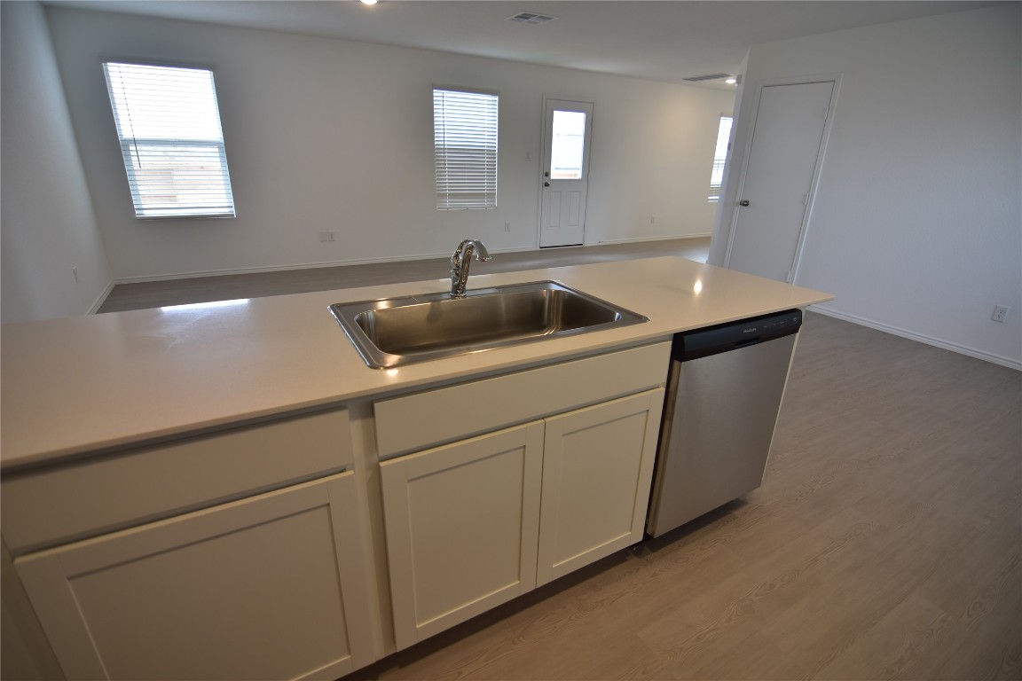 373 Keefer Kyle, TX 78640 - Photo 39 of 39 a kitchen with cabinets and sink