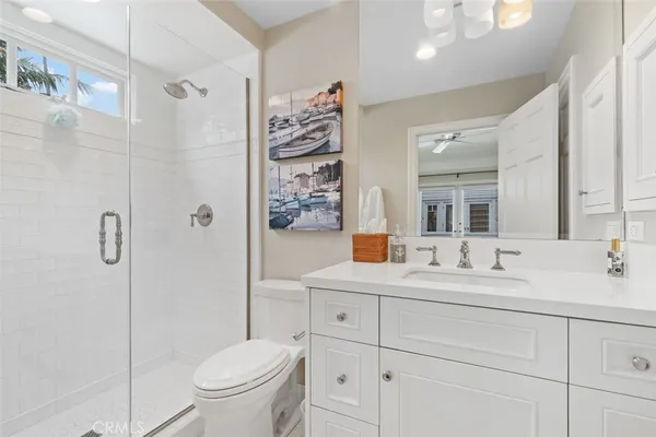 a bathroom with a toilet sink and shower