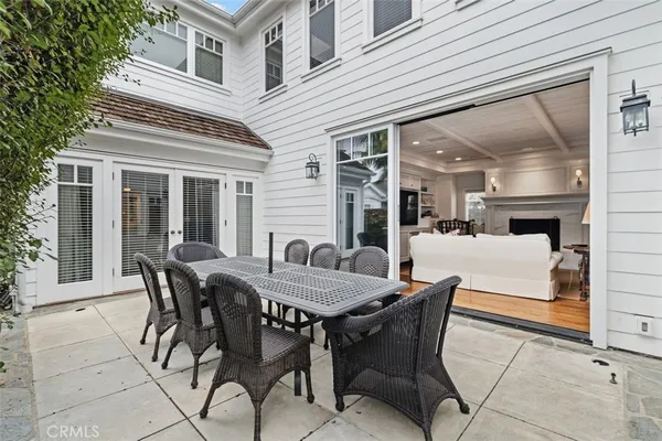 a view of a patio with table and chairs