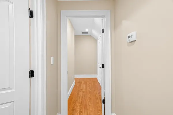 a view of a bathroom from a hallway