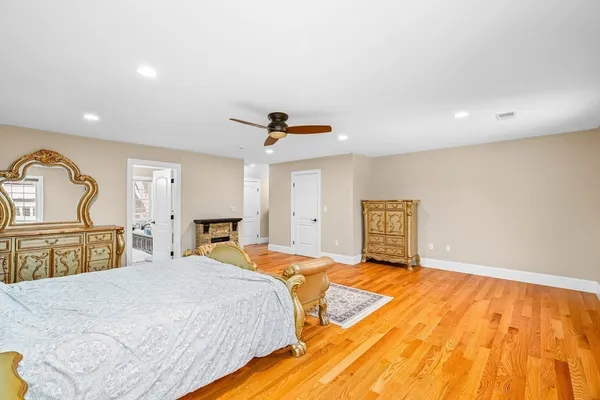a bedroom with a bed and a dresser
