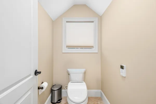 a white toilet sitting next to a white sink