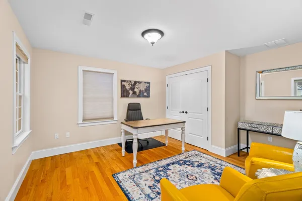 a workspace with furniture and rug