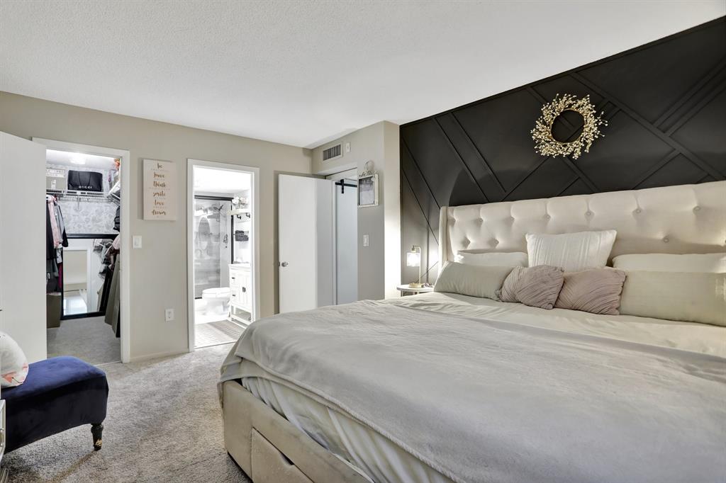 4160 Inverrary Drive, Unit 402 Lauderhill, FL 33319 - Photo 11 of 24 a bedroom with a large bed and a couch