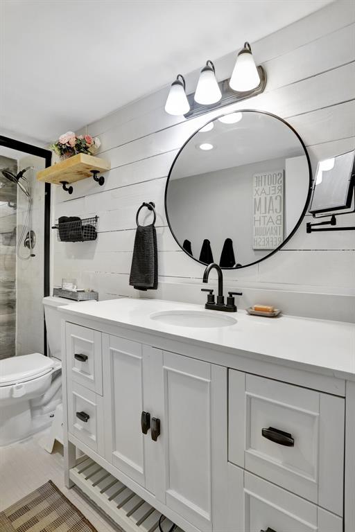 4160 Inverrary Drive, Unit 402 Lauderhill, FL 33319 - Photo 14 of 24 a bathroom with a toilet sink and mirror