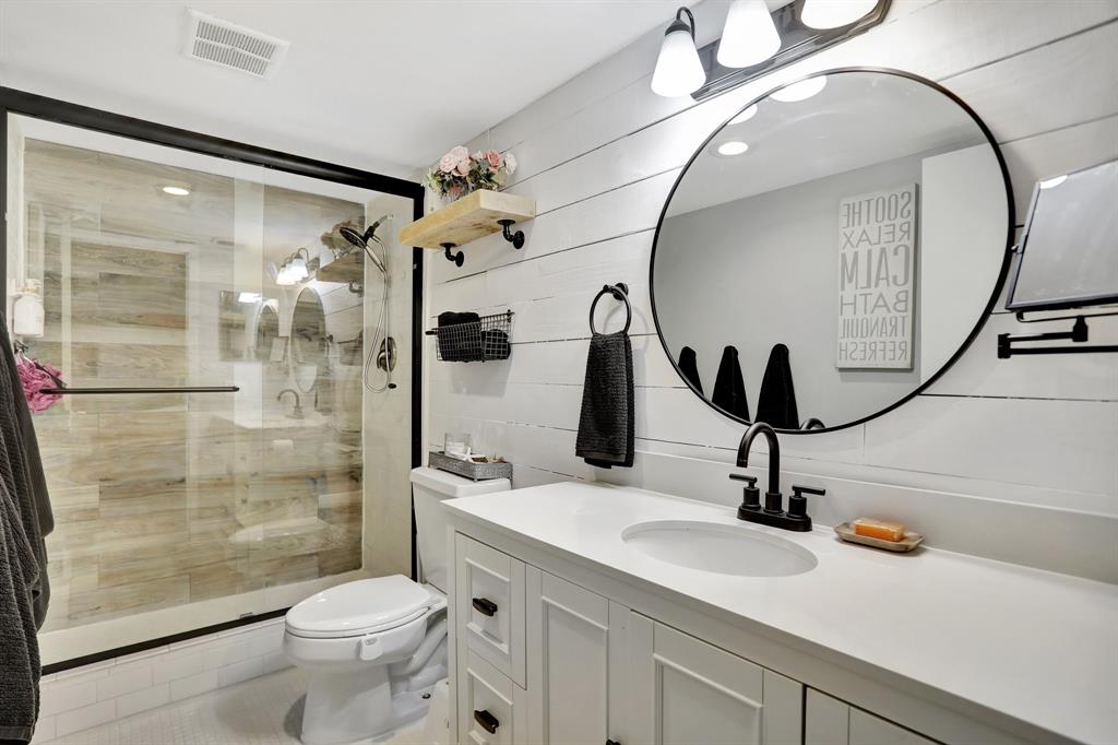 4160 Inverrary Drive, Unit 402 Lauderhill, FL 33319 - Photo 15 of 24 a bathroom with a sink a toilet and a mirror