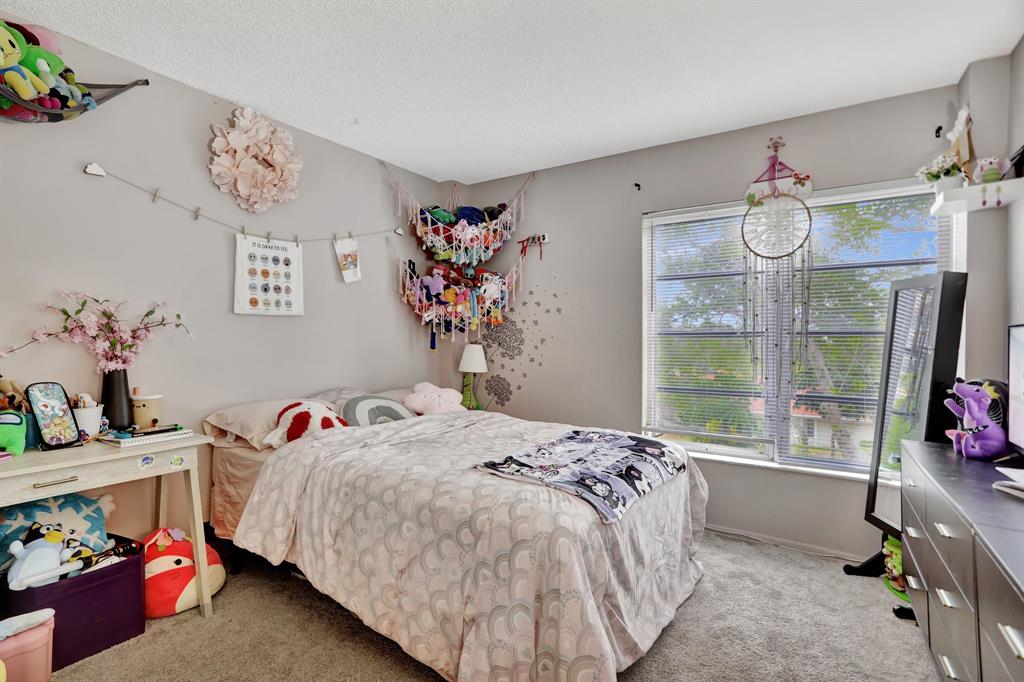 4160 Inverrary Drive, Unit 402 Lauderhill, FL 33319 - Photo 16 of 24 a bedroom with a bed and a window