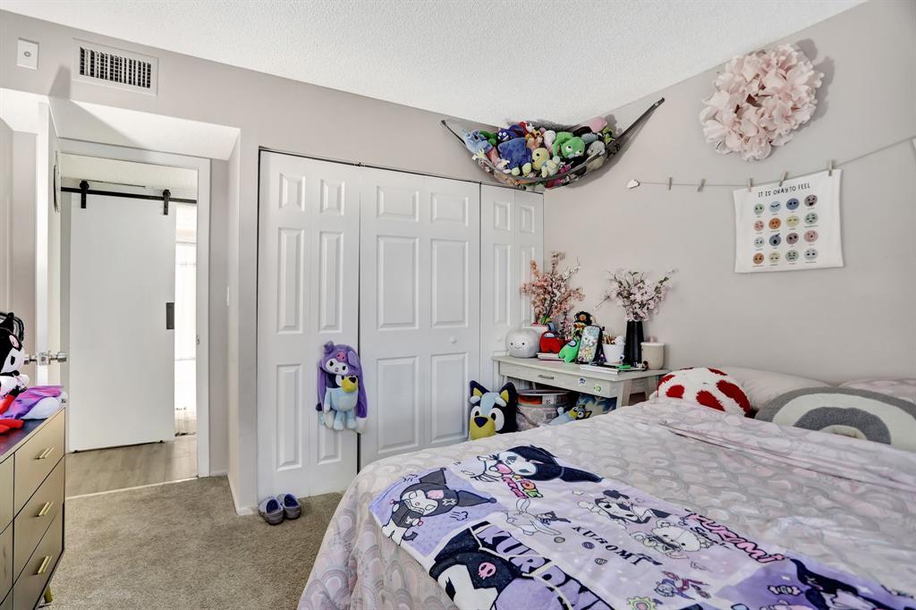 4160 Inverrary Drive, Unit 402 Lauderhill, FL 33319 - Photo 17 of 24 a bedroom with a bed and a window