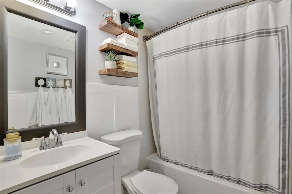 4160 Inverrary Drive, Unit 402 Lauderhill, FL 33319 - Photo 19 of 24 a bathroom with a sink vanity mirror and toilet