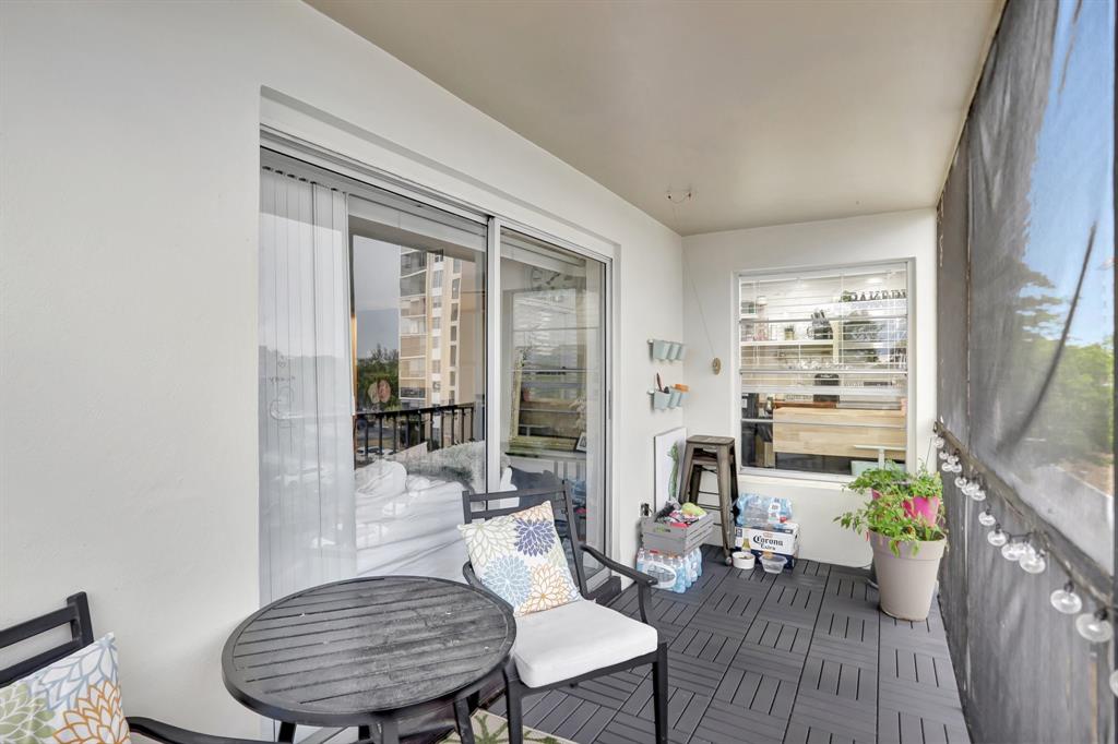 4160 Inverrary Drive, Unit 402 Lauderhill, FL 33319 - Photo 21 of 24 a living room with furniture and wooden floor