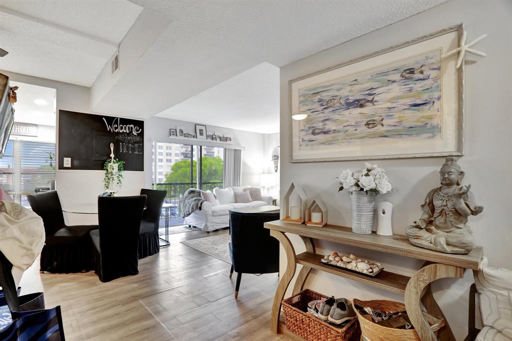 4160 Inverrary Drive, Unit 402 Lauderhill, FL 33319 - Photo 7 of 24 a living room with furniture and a flat screen tv