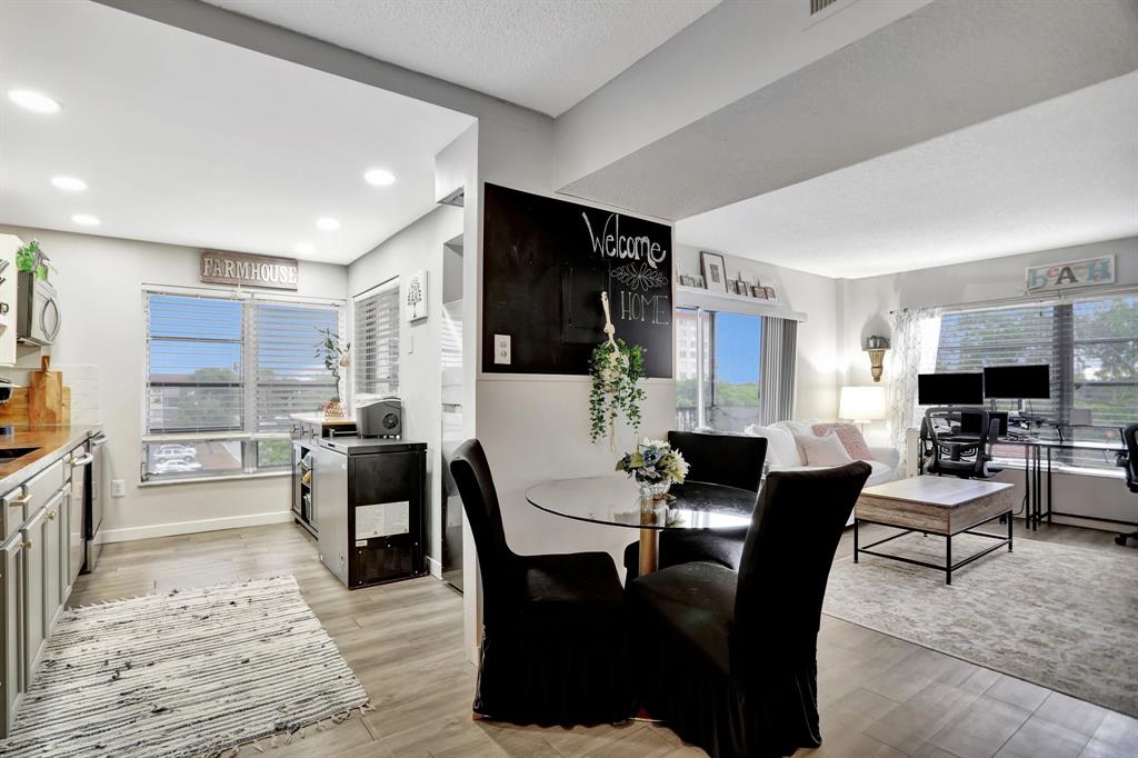 4160 Inverrary Drive, Unit 402 Lauderhill, FL 33319 - Photo 8 of 24 a dining room with furniture and window