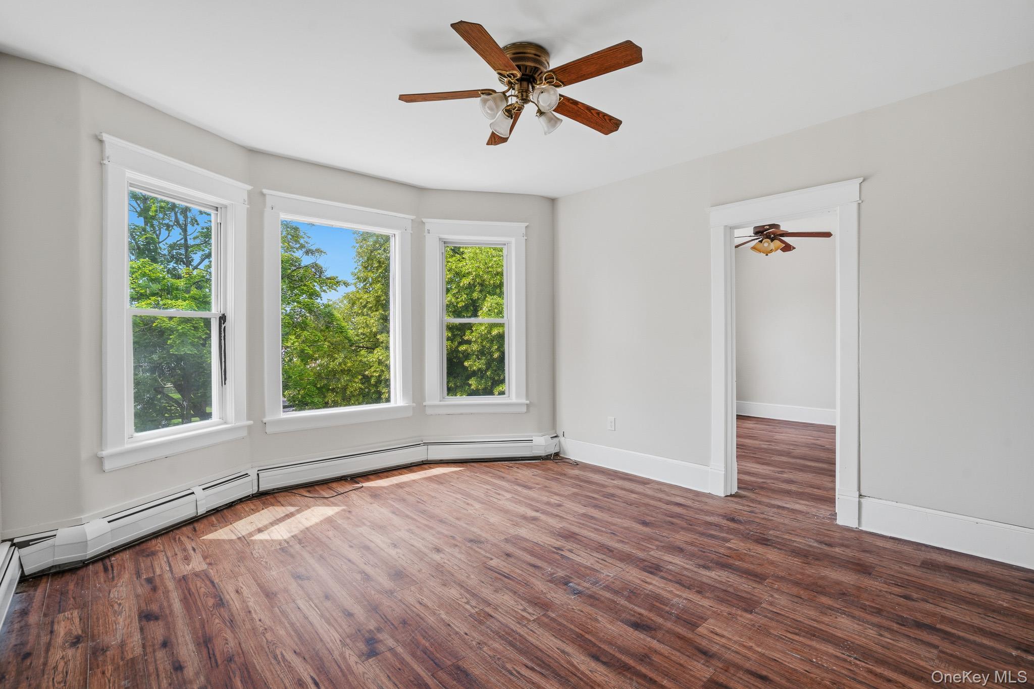 65 North Clinton Street Poughkeepsie, NY 12601 - Photo 27 of 43 wooden floor in an empty room with a window