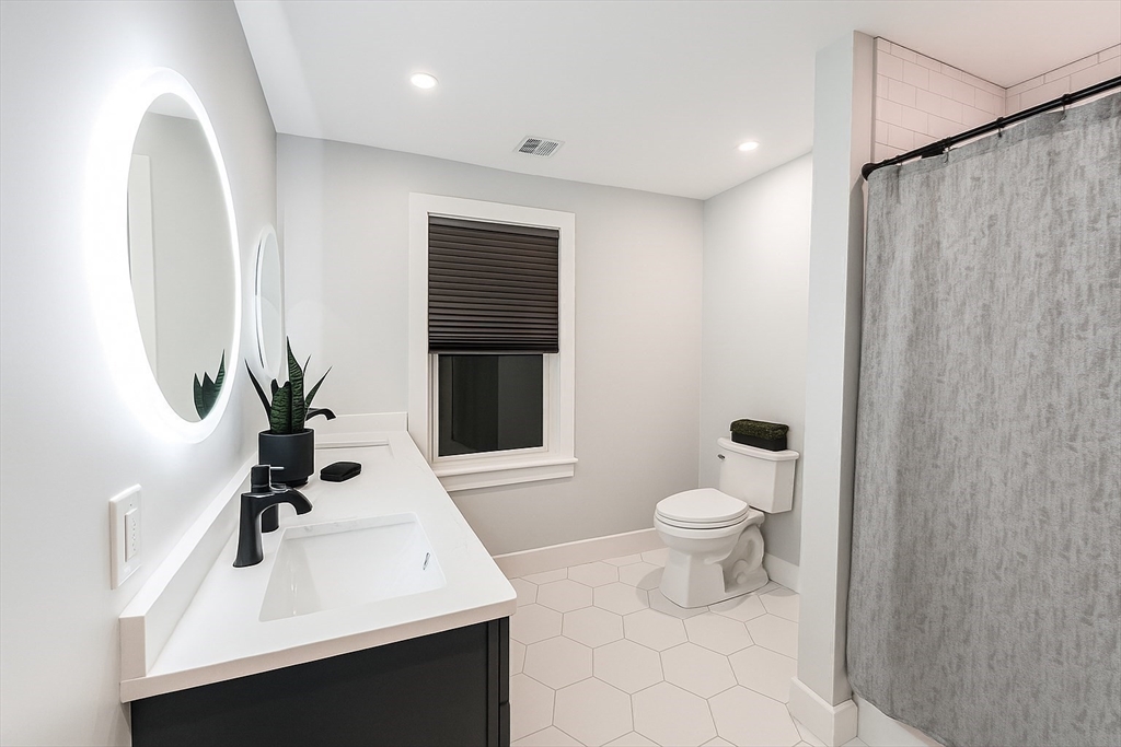 6 Rivendell Lane Millis, MA 02054 - Photo 30 of 33 a bathroom with a sink toilet and mirror