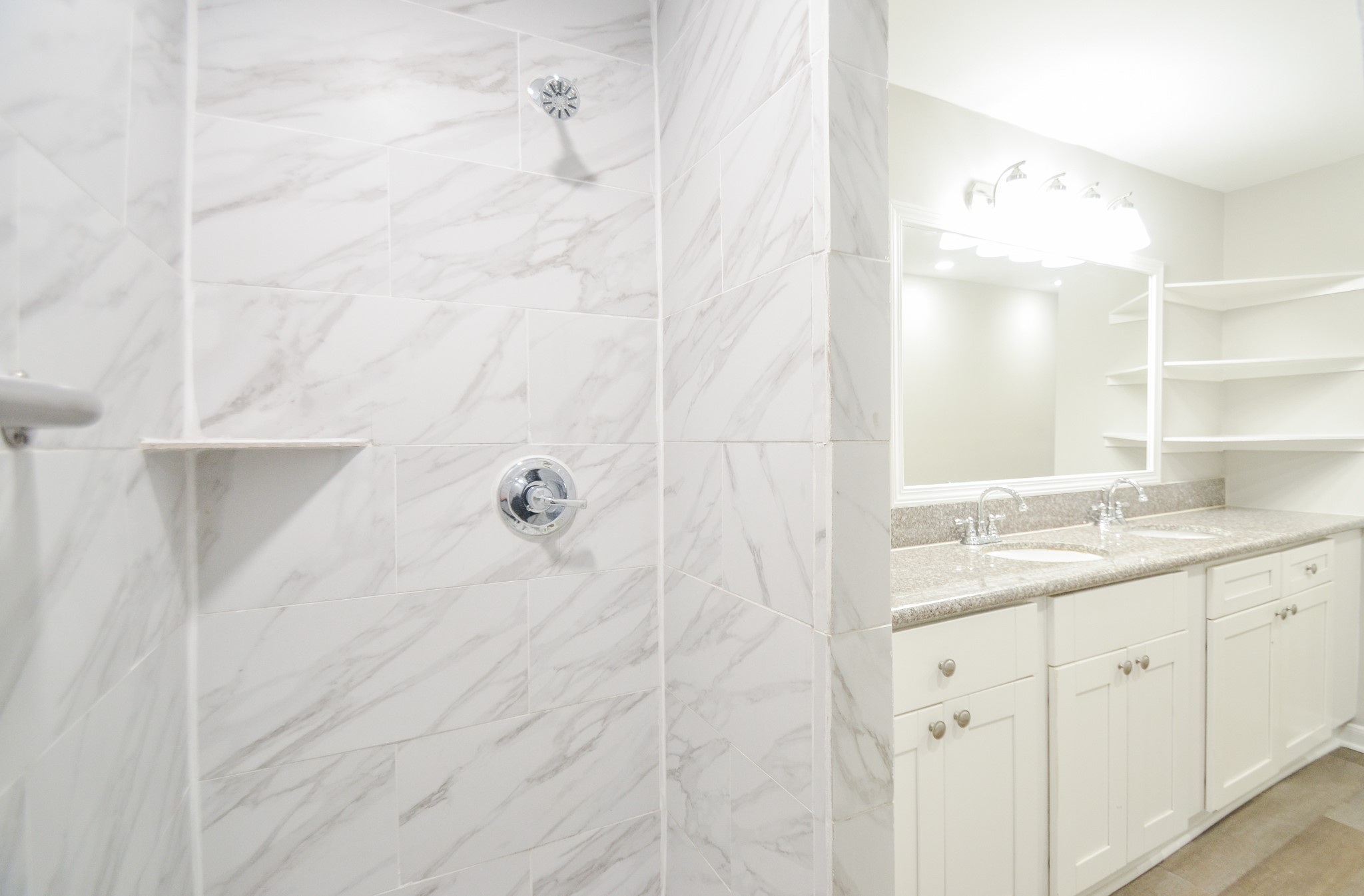 5238 Keystone Street Houston, TX 77021 - Photo 21 of 31 Shower area with neutral tones, creating a clean and inviting atmosphere.