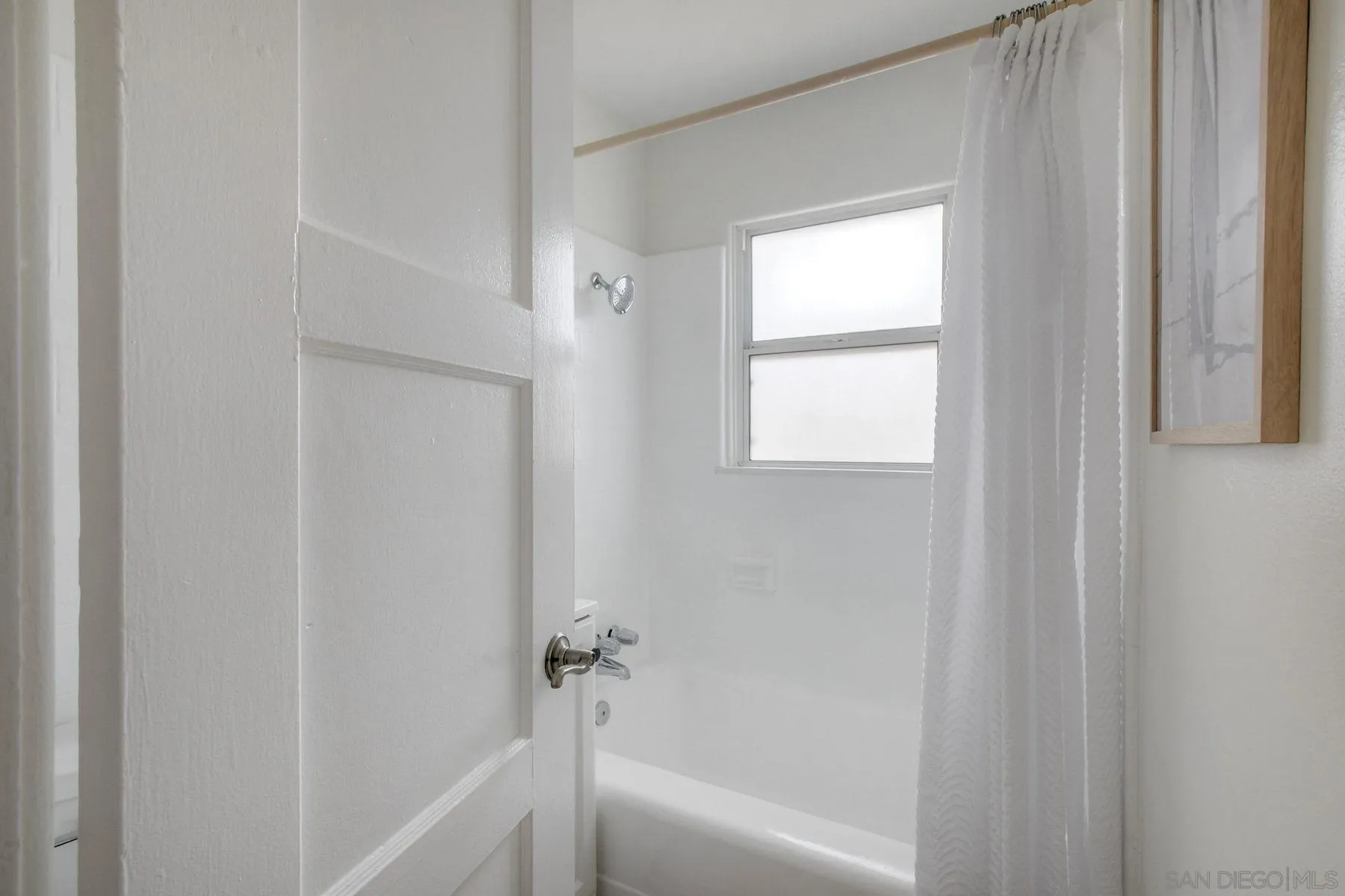 1027 Knowles Avenue Carlsbad, CA 92008 - Photo 17 of 42 a bath room with a bathtub and a shower