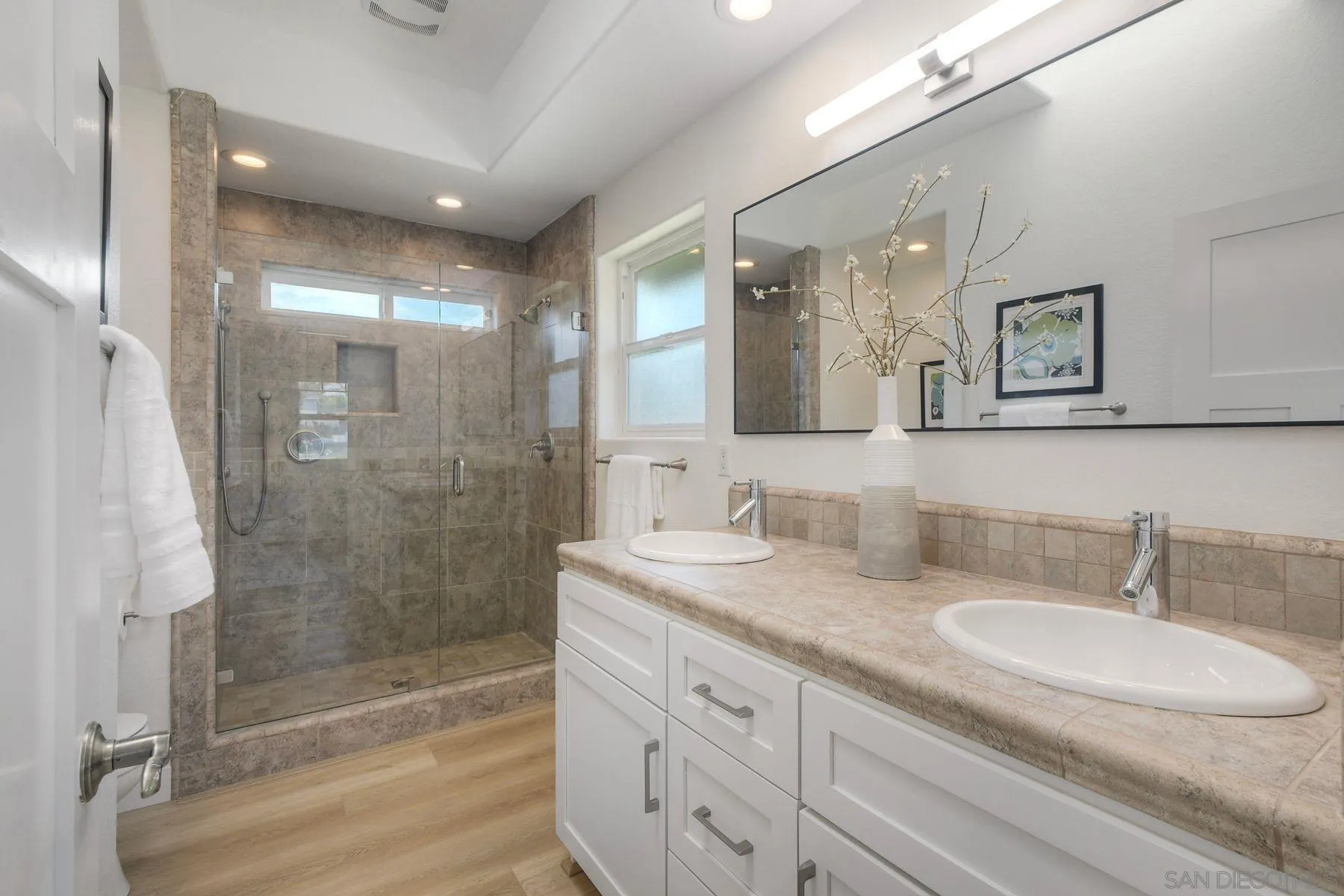 1027 Knowles Avenue Carlsbad, CA 92008 - Photo 34 of 42 a bathroom with double sink and a mirror