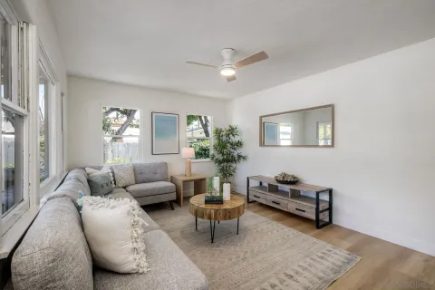 a dining room with furniture and window