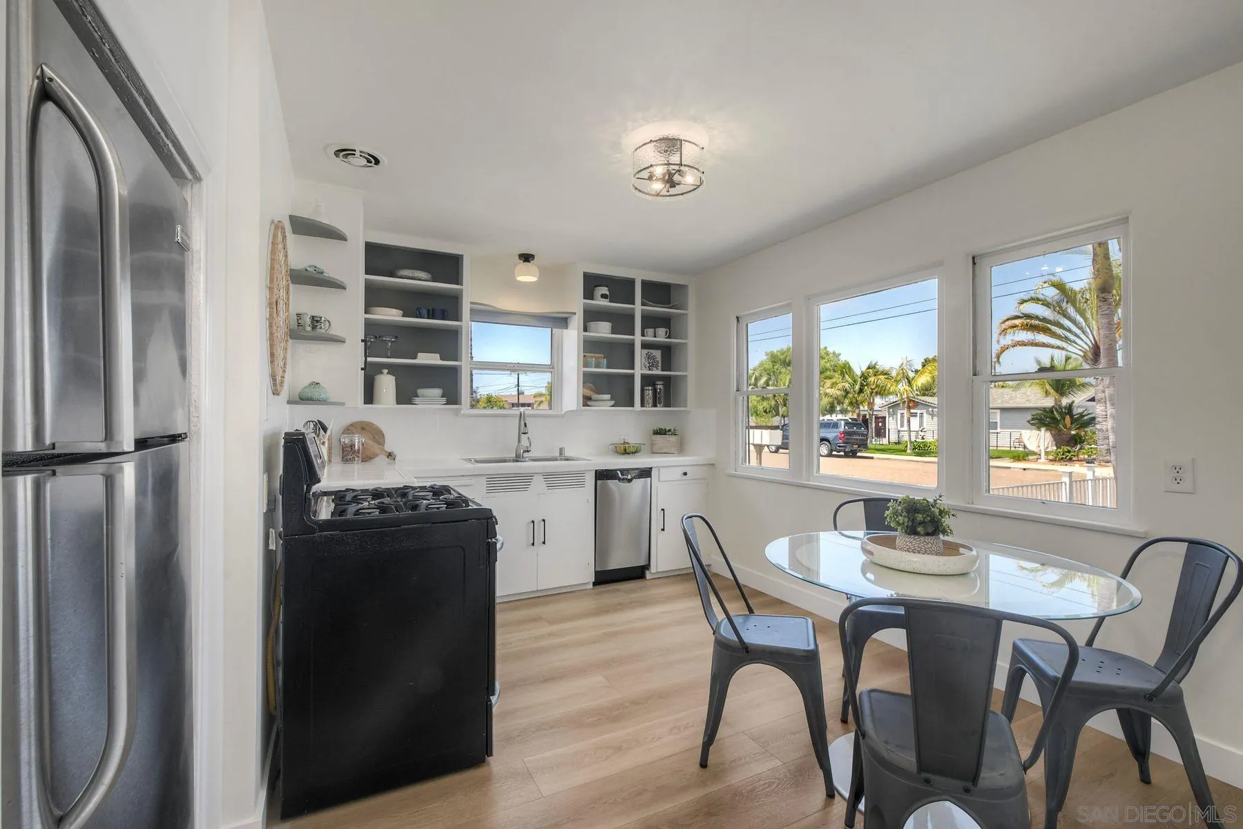 1027 Knowles Avenue Carlsbad, CA 92008 - Photo 10 of 42 a dining room with furniture and window