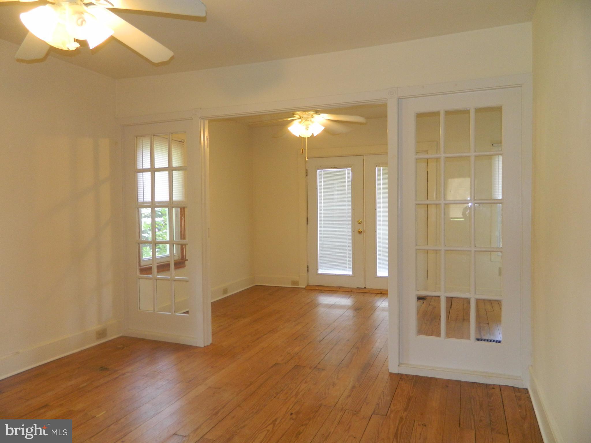 1601 Freeland Road Freeland, MD 21053 - Photo 13 of 29 an empty room with wooden floor and windows