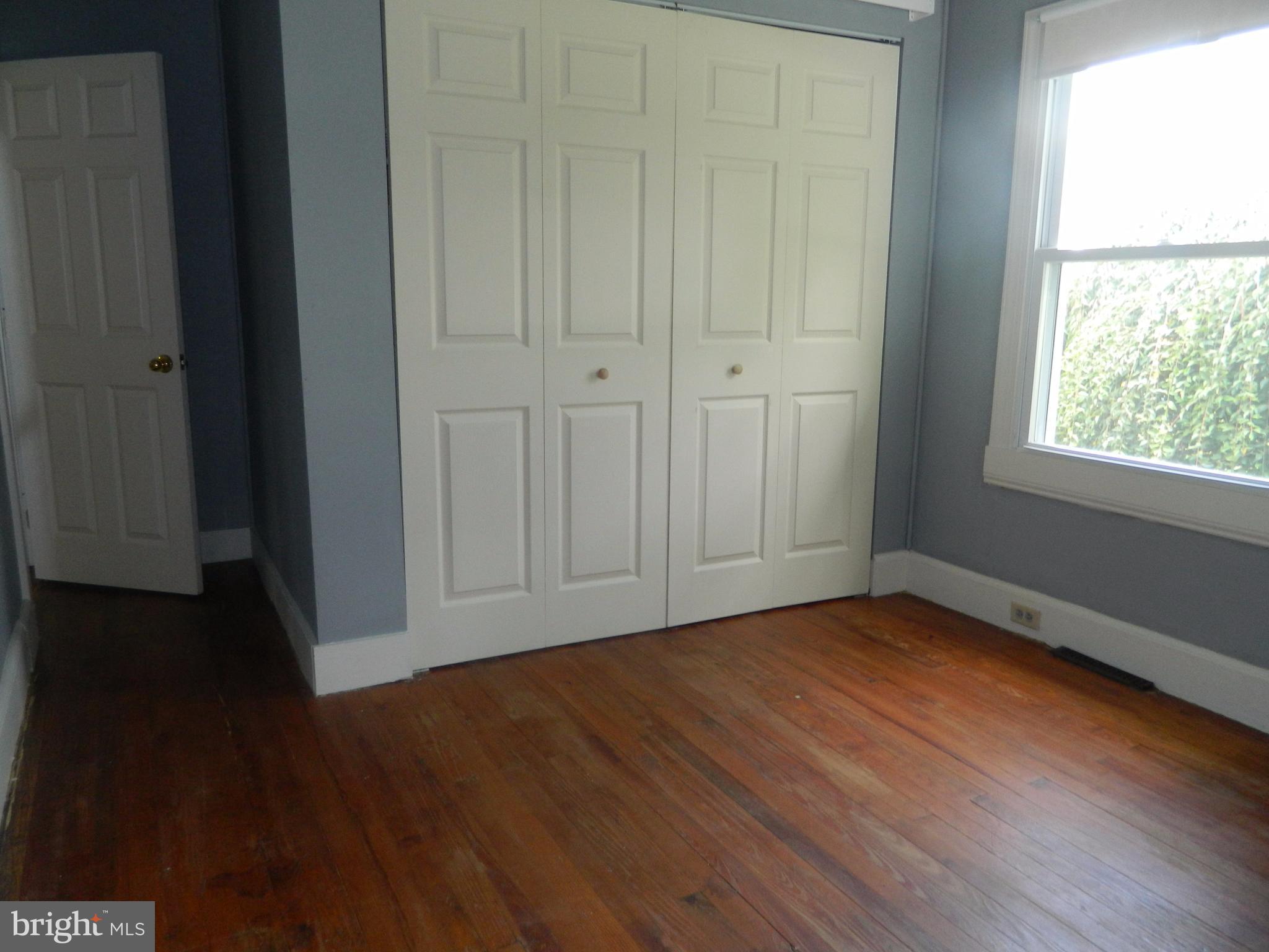 1601 Freeland Road Freeland, MD 21053 - Photo 15 of 29 a view of an empty room with wooden floor and a window