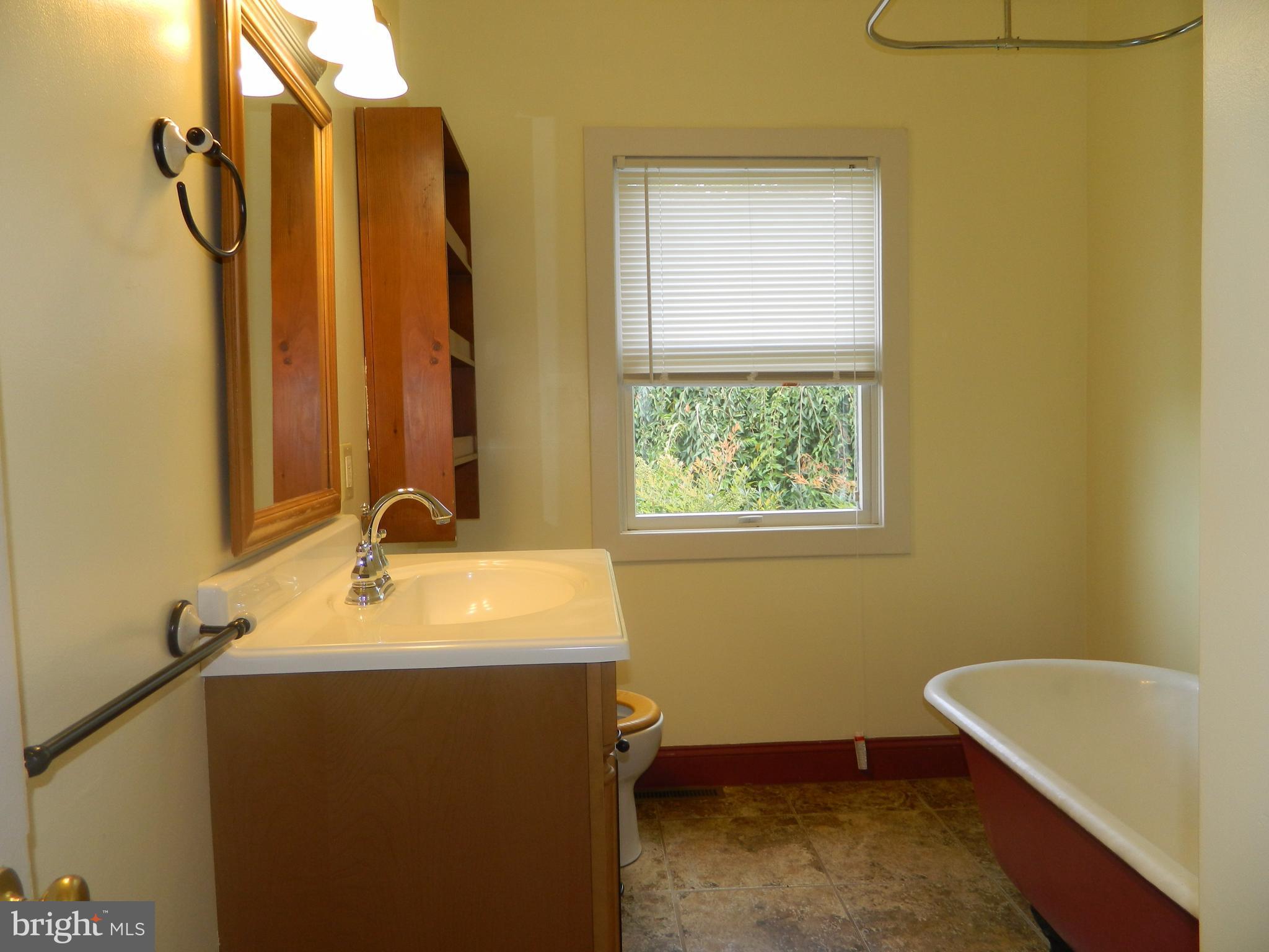 1601 Freeland Road Freeland, MD 21053 - Photo 16 of 29 a bathroom with a tub sink and mirror