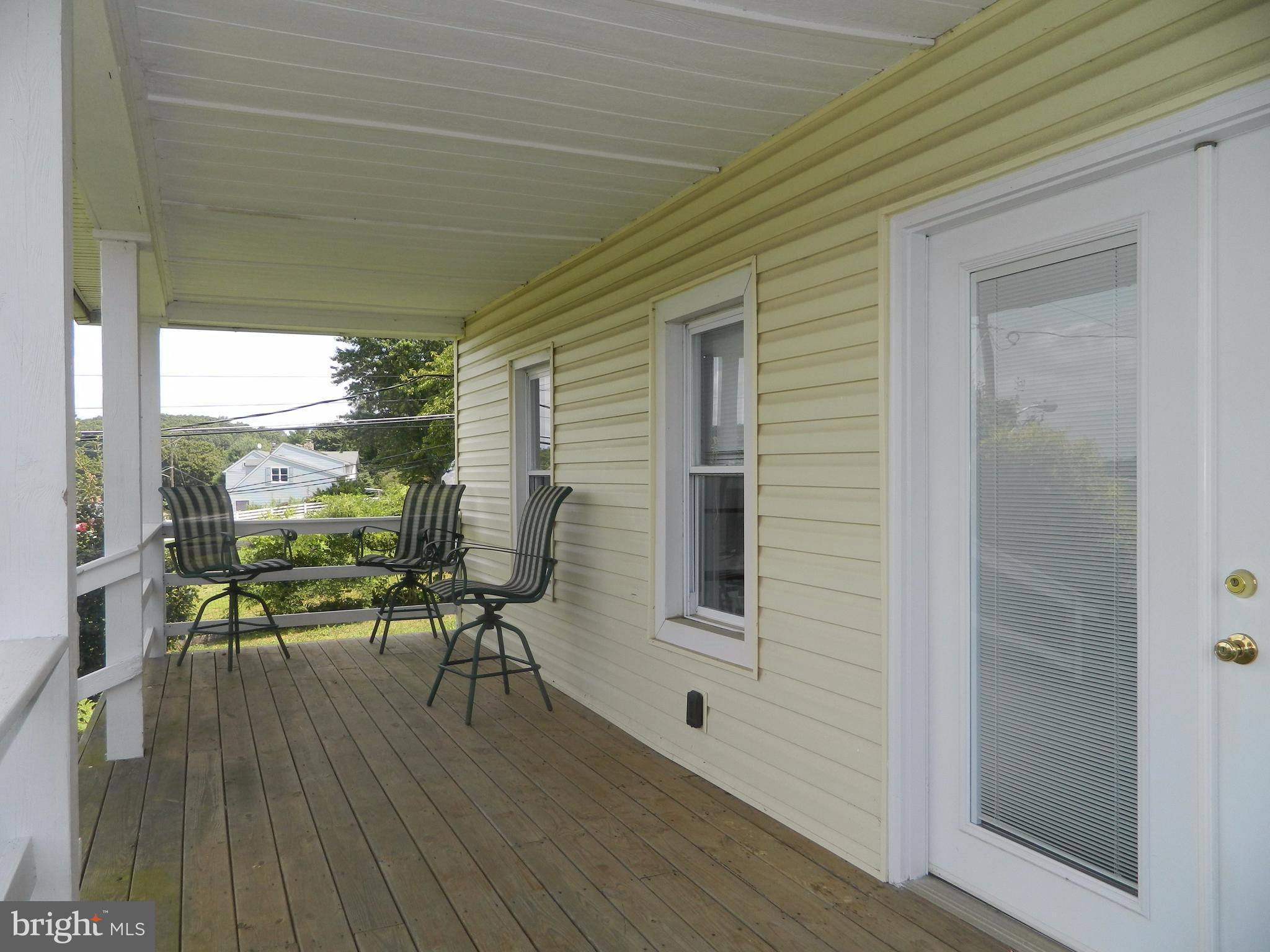 1601 Freeland Road Freeland, MD 21053 - Photo 3 of 29 a balcony with chairs and wooden floor