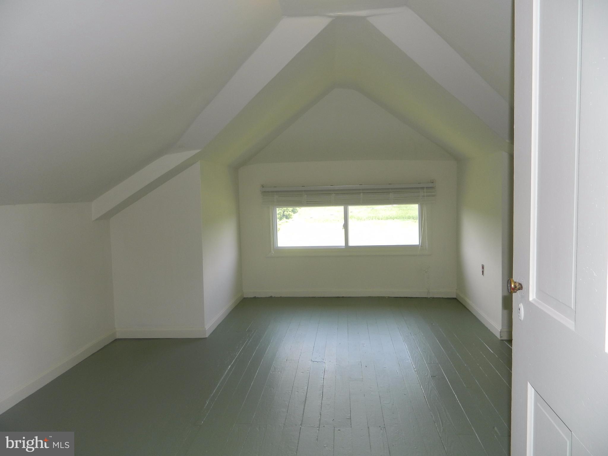 1601 Freeland Road Freeland, MD 21053 - Photo 21 of 29 an empty room with wooden floor and windows