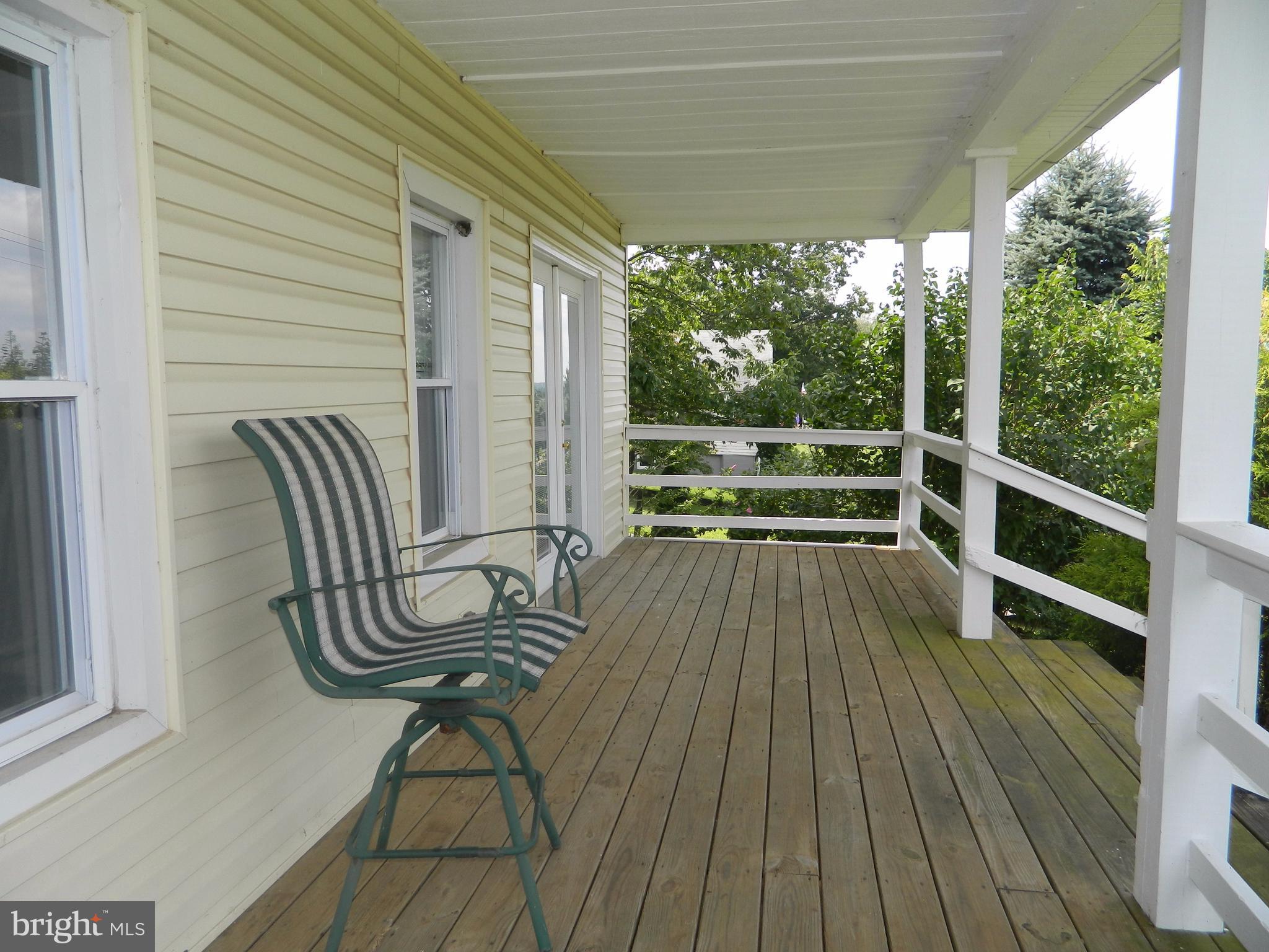 1601 Freeland Road Freeland, MD 21053 - Photo 5 of 29 a view of balcony with wooden floor and outdoor seating