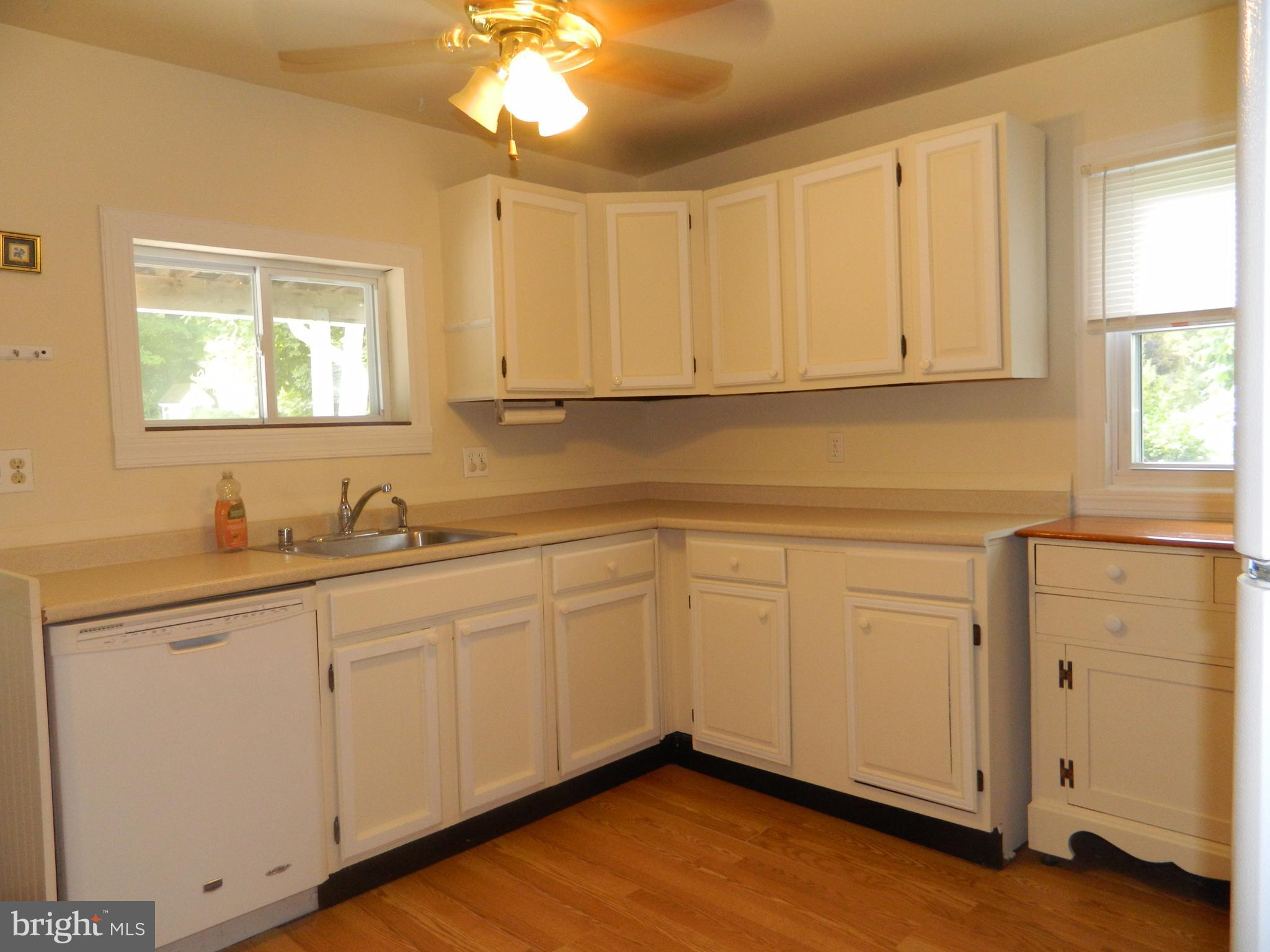1601 Freeland Road Freeland, MD 21053 - Photo 6 of 29 a kitchen with white cabinets and sink