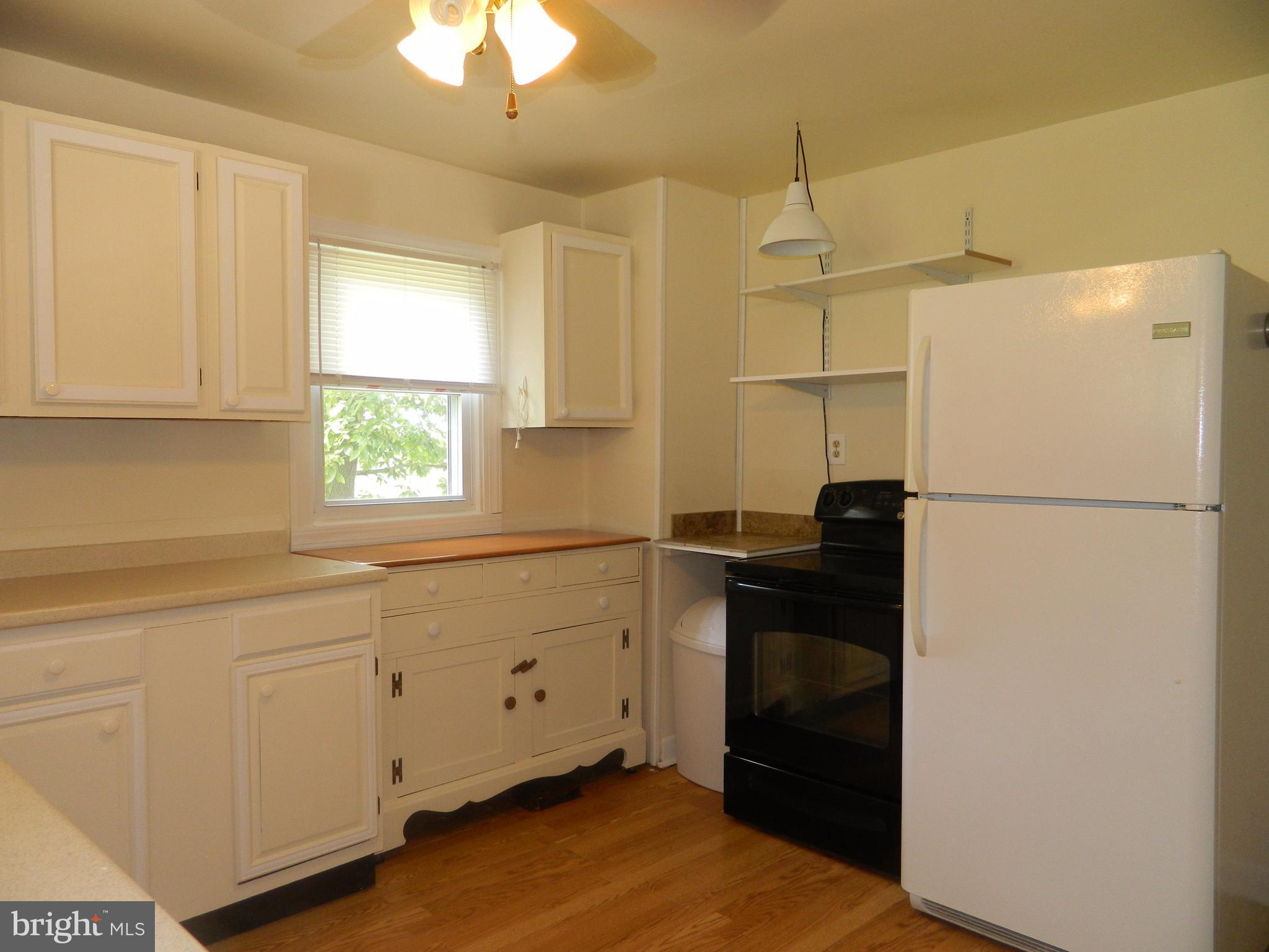1601 Freeland Road Freeland, MD 21053 - Photo 8 of 29 a kitchen with a refrigerator and a window